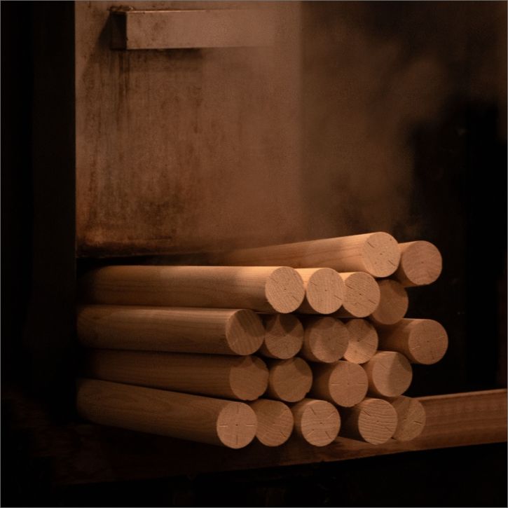 An artistic image of a pile of wooden dowels